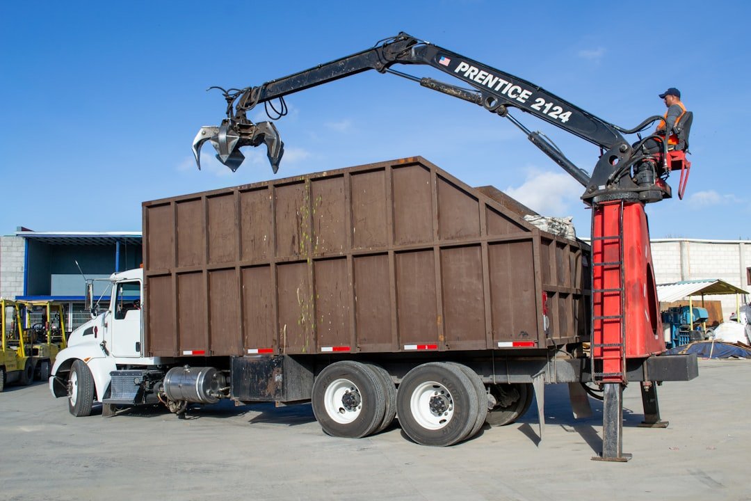 portfolio-02 crane-truck-loading-debris-into-a-large-bin-mkn6zsztat4